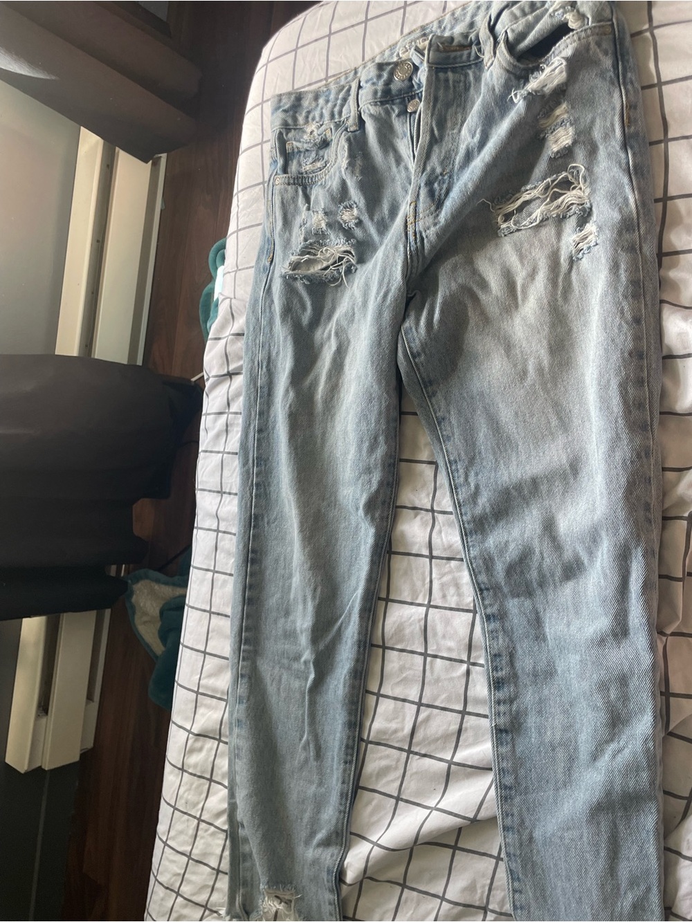 Light Blue Distressed womenโs Jeans